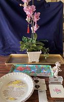 Full lot showing dinosaur figurine, orchid plant, trays and utensil rest.