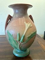 Full view of the vintage pottery vase showing overall shape, colors, and decoration.