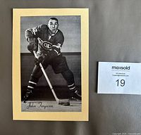 Front view of the two-piece hockey card showing John Ferguson in Montreal Canadiens uniform on a beige Manila backing.