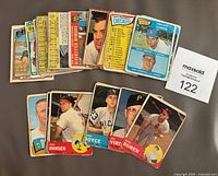 Lot of 28 vintage baseball cards from 1960-1972 laid out in two rows, showing fronts and backs with player portraits, statistics, and checklists.