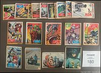 27 Batman cards laid out on table, showing both Red Bat and Blue Bat card designs with Batman and supporting characters in action scenes.