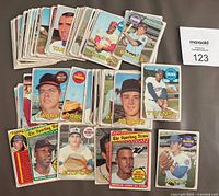 Stack of various 1969 Topps baseball cards featuring close-up of individual cards from Padres, Dodgers, Twins, Mets, and more.