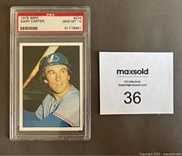 Front photo of 1975 SSPC Gary Carter Expos card graded PSA 10 in protective case beside lot number card.