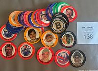 Colorful stack and spread of multiple 7-Eleven NHL hologram discs featuring various player images and team logos.