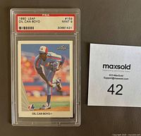 Front view of 1990 Leaf Oil Can Boyd #159 baseball card in PSA graded slab with PSA label and grade 9 MINT.