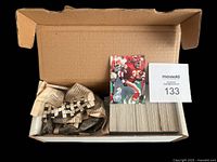 Box containing the complete 1991 Pro Set Platinum NFL football card Series #1 set with all 315 cards inside, neatly packed with some wrapping paper.