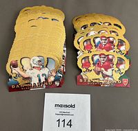 Two stacks of 1996 Pacific Crown Royale NFL cards, showing die-cut gold embossed edges and some cards featuring Dan Marino and Steve Bono.