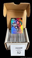 Box of 1998-99 Topps Gold Label hockey cards with protective sleeves inside a cardboard box.