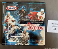 Front cover of the Kraft 2000-01 hockey card album featuring images of six NHL players.