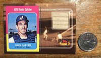 Front of the 2001 Topps Gary Carter baseball card showing 1975 rookie catcher image and embedded game-used bat piece.