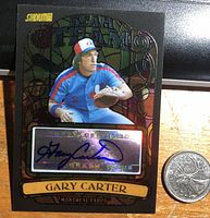Front of the card showing Gary Carter in a Montreal Expos uniform with autograph on holographic sticker and blue sharpie signature.