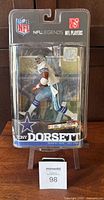 Front view of sealed Tony Dorsett McFarlane NFL Legends Series figurine in original packaging with NFL and team logos.