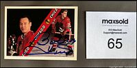 Front of the autographed hockey card showing Bobby Hull in Chicago Blackhawks uniform with signature in blue Sharpie.