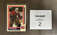 Front view of Patrick Roy rookie card replica in protective sleeve showing the image of Roy in Canadiens uniform.