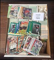 Box of stacked 1991 NFL football cards in various arrangements, showing quantity and assortments