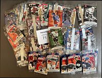 Top-down view of 84 factory sealed Post Cereal hockey cards spread out, showing various NHL players and multiple Wayne Gretzky cards.