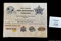 Display board showing text about Dallas Cowboys 40th Anniversary Collection, from 1960 to 1999, with team helmet image and Super Bowl logos.