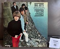 Front cover of The Rolling Stones 1966 album "Big Hits (High Tide & Green Grass)" showing band members by riverside with album title, London logo, and Mono label visible.