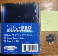 Pack of 25 Ultra Pro card top loaders sized 2 1/2" x 3 1/2", still sealed in original packaging with shrink wrap. Blue label detailing features: holds standard card size, keeps cards clean.