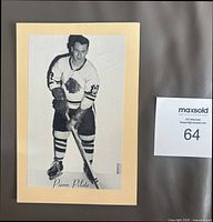 Front view showing Pierre Pilote photo on manila backing