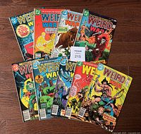 All nine Weird War Tales comics fanned out