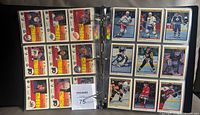 Binder opened showing multiple 1990-91 OPC Premier cards in pages