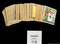 Spread of stacked Fleer Goudey football cards showing uniform vintage tan borders