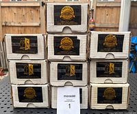 Stacked view of ten Pinnacle Select Certified football card set boxes