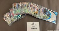 Fan view of all 50 cards fanned out in sleeves