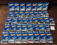 All 40 carded cars laid out