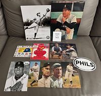 All items in lot laid out on sofa