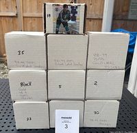 Stacked view of 10 white card storage boxes labeled 1998-99 Topps Gold Label Hockey