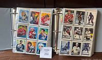 Two binders open showing multiple 1992-93 hockey cards in 9-pocket pages