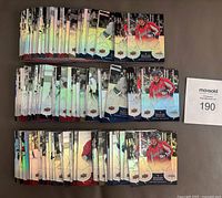 150 trading cards arranged in three rows