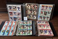 Overview of five binders open showing card pages