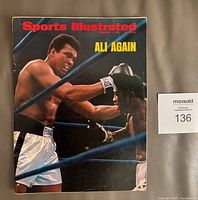 Front cover showing Muhammad Ali punching Joe Frazier