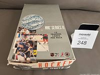 Closed display box showing front graphics and wear