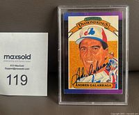 Front view showing autographed Andres Galarraga Donruss Diamond Kings card in holder next to lot number card