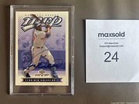 Front view of Vladimir Guerrero Upper Deck MVP card showing autograph in blue Sharpie inside plastic case