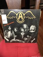 Front cover of Aerosmith Get Your Wings album showing band members and logo