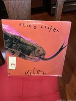 Front of Alice Cooper Killer LP album cover with snake head image and handwritten text.