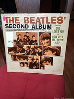 Front cover of The Beatles' Second Album showing title, band photos, and song highlights.
