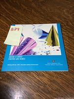 Front cover of the 2005 Royal Canadian Mint Birthday Gift Set folder titled 'Make A Wish' with festive party hats and confetti graphics.