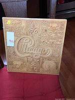 Front view of vintage Chicago vinyl LP album with ornate embossed cover artwork in gold tone