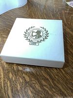 White collector's box with gold Coca Cola Collectors Club logo and 20th anniversary mark