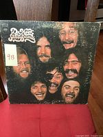 Front cover photo of Dr. Hook Sloppy Seconds LP album showing band member faces and album title.