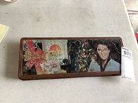 Top view of the full tin showing Christmas presents, tree, and Elvis Presley image.