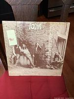 Front cover of the vintage Foghat LP album showing the band posing against a brick wall with the Foghat logo.