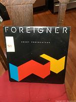 Front cover of Foreigner Agent Provocateur vinyl LP showing geometric design and text.