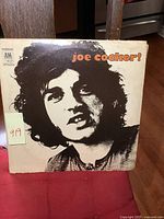 Front cover of the Joe Cocker vinyl LP album with title and portrait artwork.